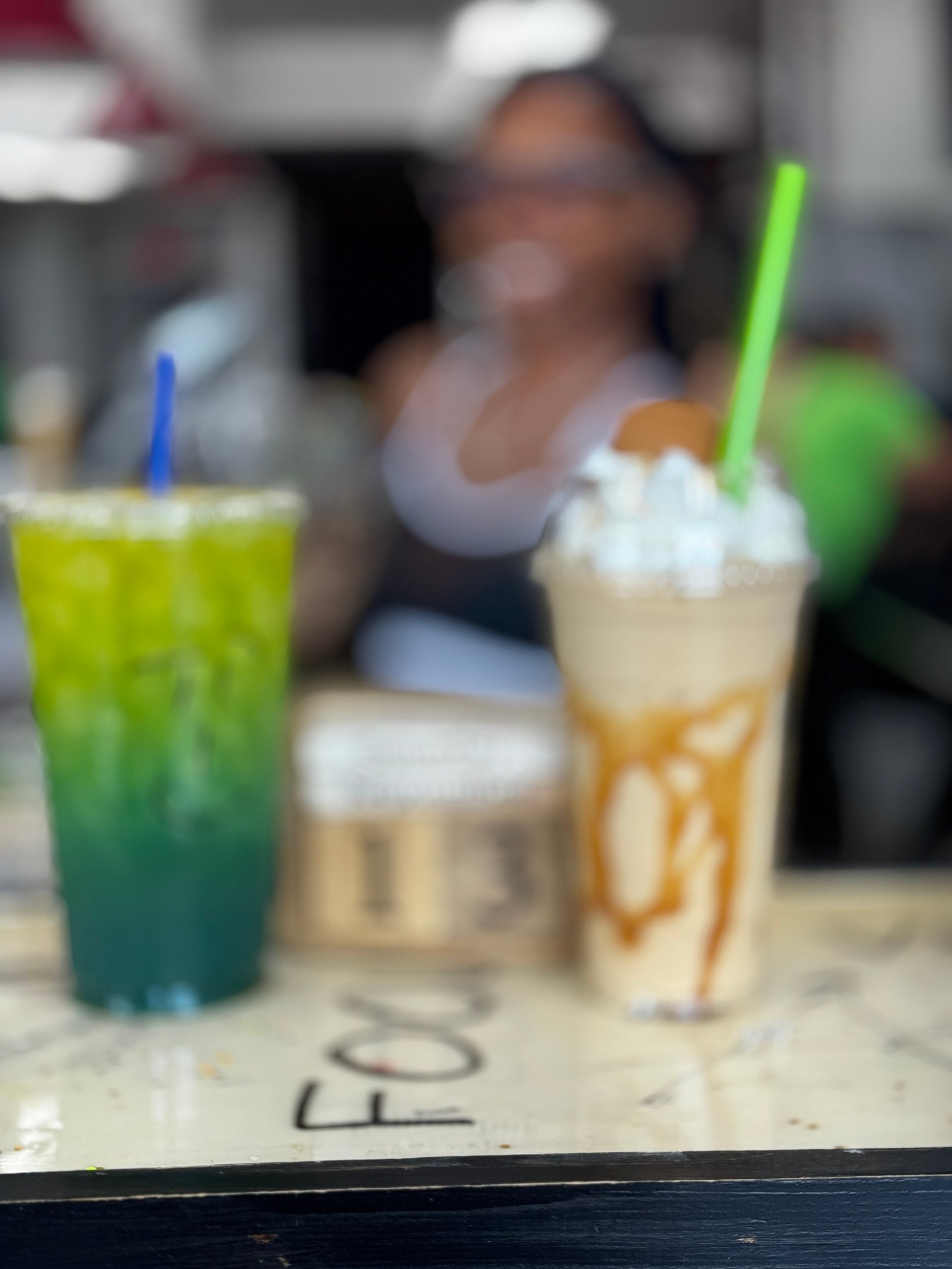 Three colorful beverages with straws on a table at Duncanville Nutrition